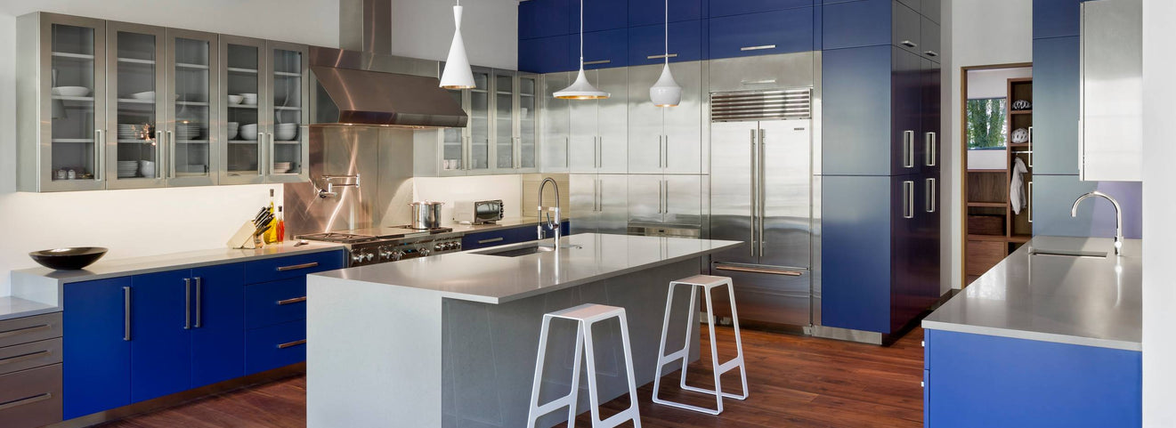 Stainless Steel Cabinets, But Make It Bold (This Navy + Metal Kitchen Slaps)